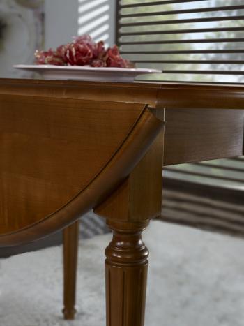 Table ronde à volets réalisée en Merisier Massif de style Louis XVI avec  2 allonges de 40 cm